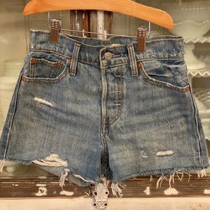 High rise vintage ripped denim Levi’s shorts.